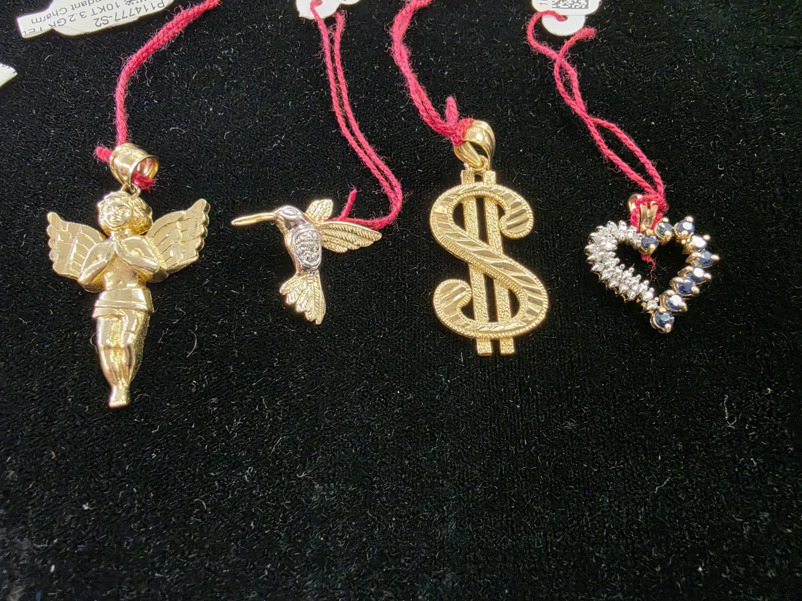 Gold pendant collection with heart and decorative designs